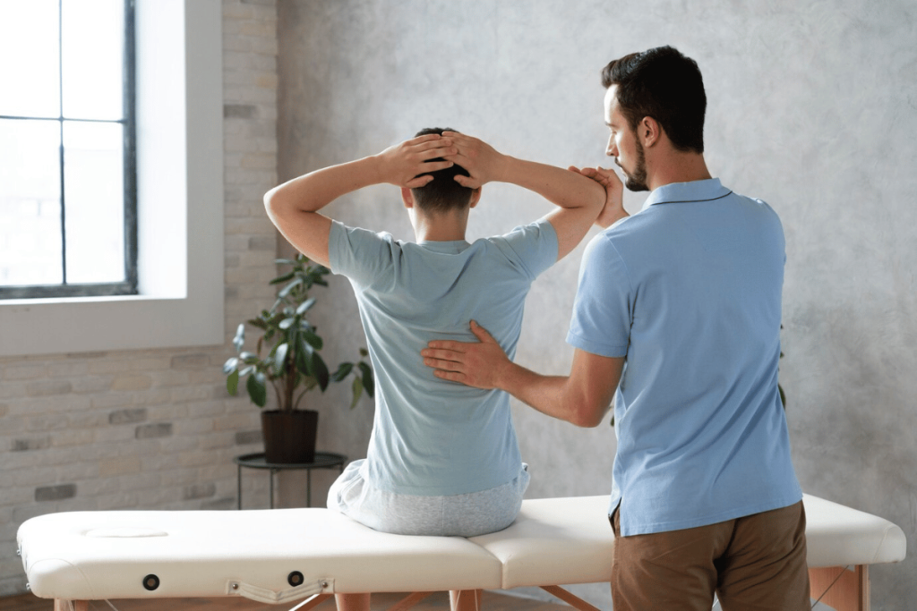 A person getting a back massage from a physical therapist.